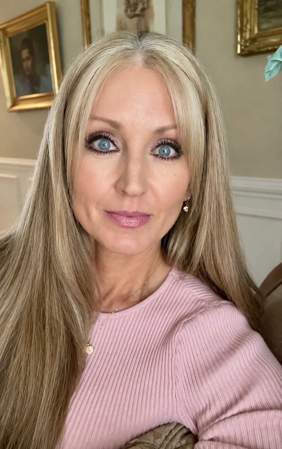 Carol Whitaker, life coach for women, smiling in a pink sweater