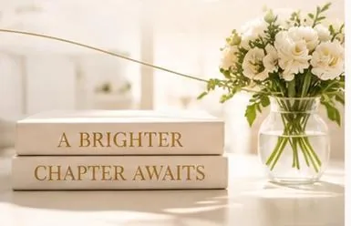 Books reading A brighter chapter awaits beside white flowers